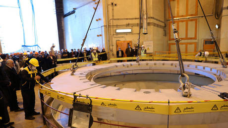 FILE PHOTO: Members of the media and officials tour the water nuclear reactor at Arak, Iran. December 2019. © WANA / Reuters