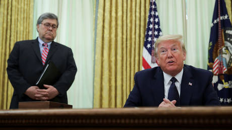 FILE PHOTO: US President Donald Trump speaks to reporters as Attorney General Bill Barr watches in Washington, US, on May 28, 2020.