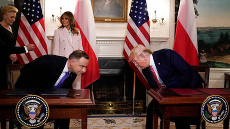 US President Donald Trump and Poland's President Andrzej Duda stand as first lady Melania Trump and Agata Kornhauser-Duda look on in the Diplomatic Reception Room of the White House in Washington, US, June 12, 2019. © Reuters / Kevin Lamarque