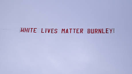 A White Lives Matter banner is flown over the Manchester City versus Burnley Premier League match. © Reuters