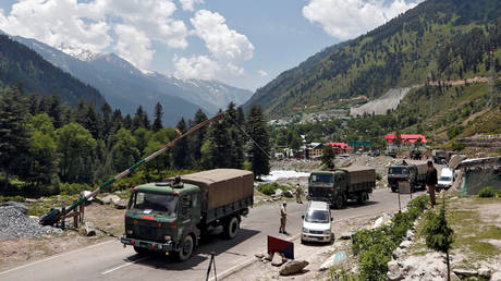 Indian army trucks move along a highway leading to Ladakh, at Gagangeer in Kashmir's Ganderbal district June 17, 2020