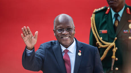 Tanzanian President John Pombe Magufuli gestures while arriving at the Loftus Versfeld Stadium in Pretoria, South Africa, for the inauguration of Incumbent South African President Cyril Ramaphosa on May 25, 2019