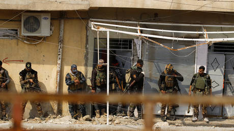 FILE PHOTO: Iraqi federal police and special forces members