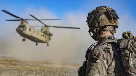 FILE PHOTO: U.S. Army Staff Sgt. Jason N. Bobo watches as a CH-47 Chinook helicopter prepares to land. December, 29, 2019 in Southeastern Afghanistan