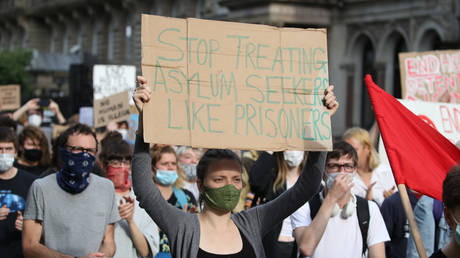 Demonstrators in George Square in Glasgow during a No Evictions Glasgow protest against the living conditions of refugees