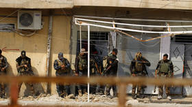 Iraqi forces raid HQ of Iran-backed militia as US coalition denies any involvement