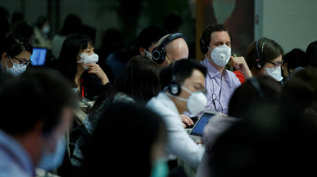 FILE PHOTO: Journalists attend the daily press briefing of the Chinese Foreign Ministry in Beijing, China, March 18, 2020. © Reuters / Thomas Peter