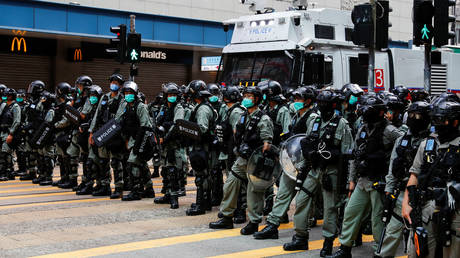 A row of riot police officers is seen during a march against the national security law in Hong Kong, China on July 1, 2020.