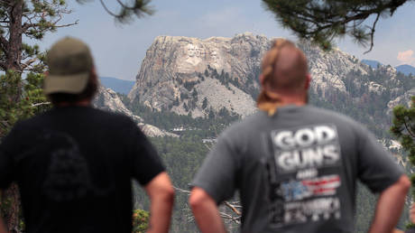 Visitors look at Mount Rushmore National Monument on July 02, 2020 near Keystone, South Dakota
