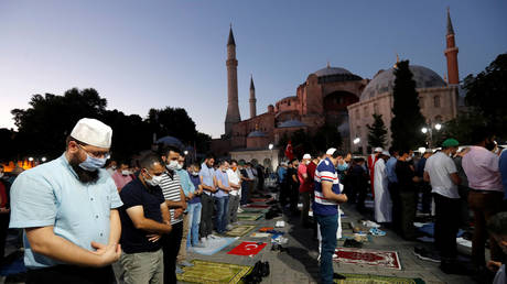 Muslims gather for evening prayers in front of the Hagia Sophia in Istanbul, Turkey, July 10, © REUTERS/Murad Sezer