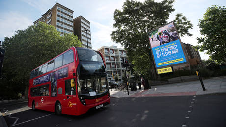 FILE PHOTO: A government and NHS Covid-19 Test and Trace advert is seen on a billboard in London © REUTERS/Hannah McKay/File Photo