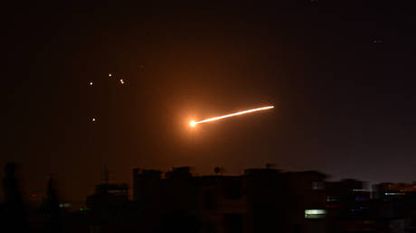 FILE PHOTO. Syrian air defence intercepts a missile in the sky over Damascus.