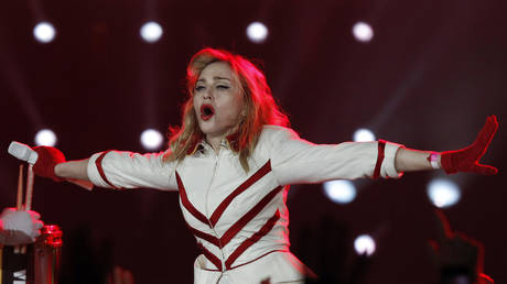 Madonna performs on stage during her MDNA tour at St. Petersburg Sports and Concert Complex