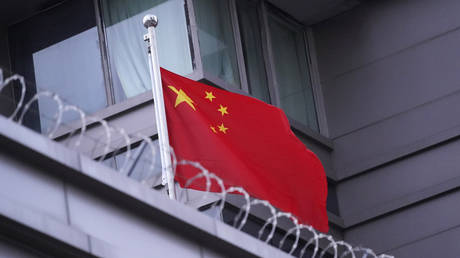 The flag of China flies outside the Chinese Consulate Wednesday, July 22, 2020, in Houston. © AP Photo/David J. Phillip