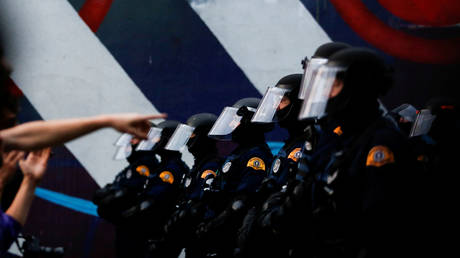 FILE PHOTO: A line of Washington State Patrol officers in riot gear