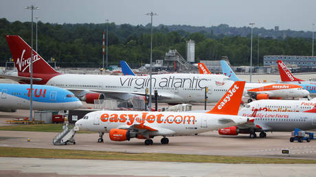 FILE PHOTO: Easyjet, Virgin Atlantic and TUI Airways aircraft are seen at Manchester Airport. June 8, 2020. © Reuters/Phil Noble