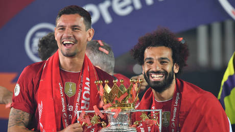 Dejan Lovren and Mo Salah celebrate Liverpool's Premier League title win. © Reuters