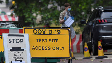 A sign is seen at a drive-through coronavirus disease (COVID-19) testing facility in Hyde Park, following the outbreak of the coronavirus disease, London, Britain, June 11, 2020