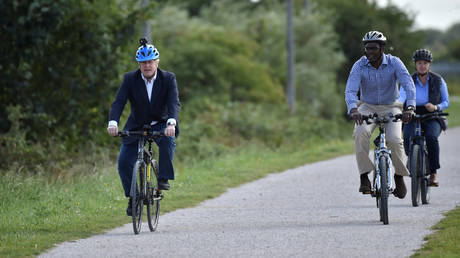 FILE PHOTO: Britain's Prime Minister Boris Johnson and Conservative MP for Broxtowe Darren Henry ride their bikes at the Canal Side Heritage Centre