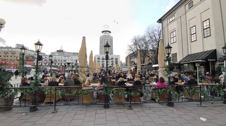 FILE PHOTO: Citizens enjoy a sunny day outside in Stockholm, Sweden on April 04, 2020
