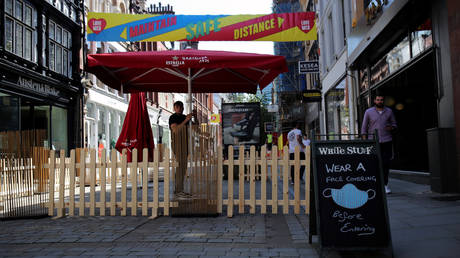 A sign seen outside a bar as the area faces local restrictions in a bid to avoid a local Covid-19 lockdown, in Manchester, Britain, July 31, 2020. © REUTERS/Molly Darlington