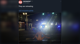 Naked Athena protester confronts Portland police 