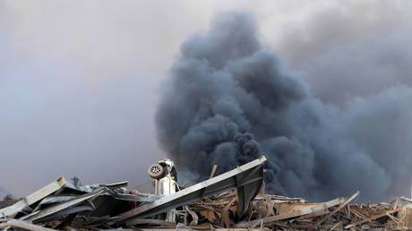 Smoke and damage at the site of the explosions in Beirut's port area on August 4, 2020. © REUTERS/Mohamed Azakir