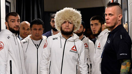 UFC lightweight champion Khabib Nurmagomedov, cousin Abubakar (left) and teammate Islam Makhachev (back right). © Zuffa LLC via Getty Images