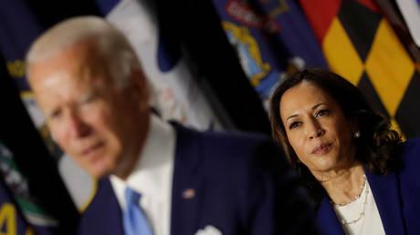 Democratic vice presidential candidate Senator Kamala Harris looks on as Democratic presidential candidate and former Vice President Joe Biden speaks in Wilmington, Delaware, U.S., August 12, 2020. © REUTERS/Carlos Barria