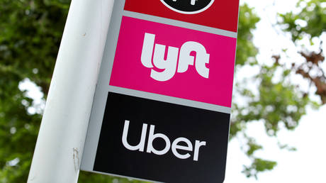 FILE PHOTO: A sign marks a rendezvous location for Lyft and Uber users at San Diego State University in California.