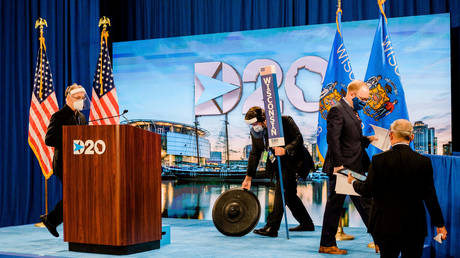 DNC staff change the set as Milwaukee native and Convention Secretary Jason Rae walks off stage at the Wisconsin Center on the second day of the Democratic National Convention in Milwaukee, Wisconsin, U.S. August 18, 2020