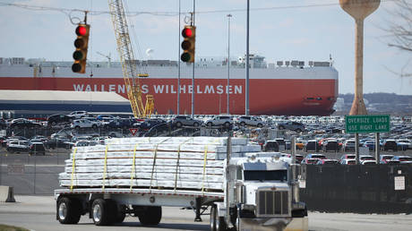 FILE PHOTO: A loaded truck leaves the Dundalk Marine Terminal on March 9, 2018 in Baltimore, Maryland.