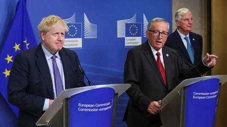 FILE PHOTO: European Commission President Jean-Claude Juncker, European Union's chief Brexit negotiator Michel Barnier and Britain's Prime Minister Boris Johnson meet after agreeing on the Brexit deal, at the sidelines of the European Union leaders summit, in Brussels, Belgium October 17, 2019.