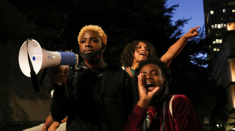 FILE PHOTO: Black Lives Matter demonstrators take part in a protest against racial inequality and police violence in Portland, Oregon.