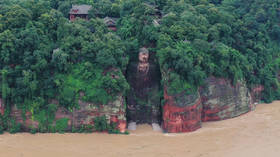 China rushes to evacuate 100,000 flood victims and to save 1,200-year-old world heritage site (PHOTOS)