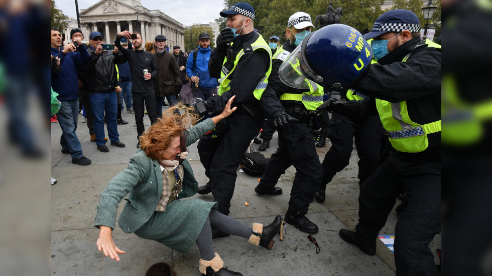 WATCH: London police slam woman to the ground during anti-lockdown protest in Trafalgar Square