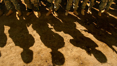 FILE PHOTO: Soldiers of the U.S. Army's 82nd Airborne Division stand in formation at a newly formed Joint Security Station in Baghdad, Iraq,