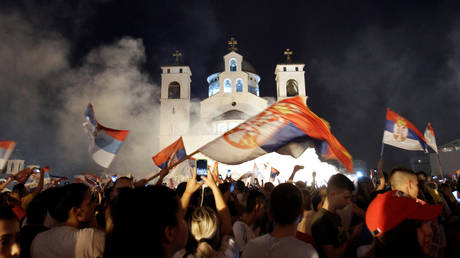 Opposition supporters celebrate election victory outside the Cathedral of the Resurrection of Christ in Podgorica, Montenegro August 31, 2020.