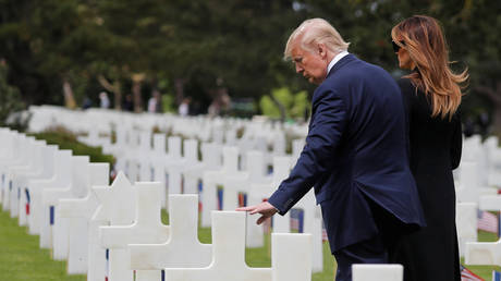 FILE PHOTO: US President Donald Trump and First Lady Melania Trump at the Normandy American Cemetery, commemorating the 75th anniversary of the D-Day landings, France, June 6, 2019