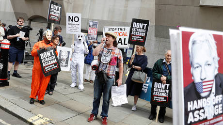 Supporters of WikiLeaks founder Julian Assange are seen outside the Old Bailey, the Central Criminal Court during a hearing to decide whether Assange should be extradited to the United States, in London, Britain September 7, 2020.
