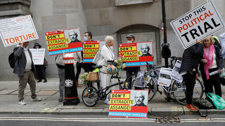 Supporters of WikiLeaks founder Julian Assange hold placards outside the Old Bailey, the Central Criminal Court ahead of a hearing to decide whether Assange should be extradited to the United States, in London, Britain September 7, 2020.