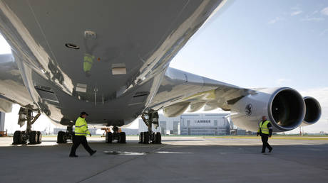 Ground staff stand under Airbus A380 aircraft for Air France KLM