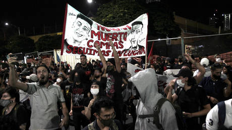 People shout slogans during the sixth day of protest against police brutality on September 14, 2020 in Medellin, Colombia