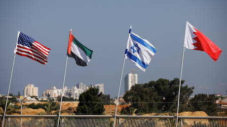 The flags of the U.S., United Arab Emirates, Israel and Bahrain flutter along a road in Netanya, Israel September 14, 2020.