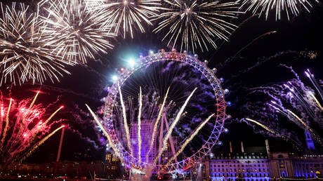 Fireworks explode over the London Eye wheel during New Year celebrations in central London, Britain, January 1, 2020.