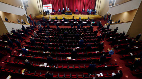 FILE PHOTO: Lebanese members of parliament attend a legislative session in a theatre hall to allow social distancing amid spread of the coronavirus disease (COVID-19), in UNESCO Palace building in Beirut, Lebanon April 21, 2020.