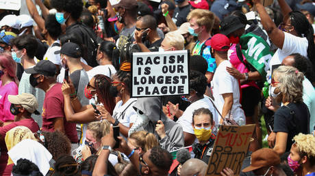 Protesters at the 'Get Your Knee Off Our Necks' Commitment March in Washington, DC, August 28, 2020. © REUTERS/Tom Brenner