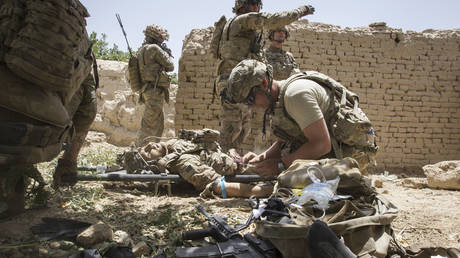 FILE PHOTO: US Army soldiers secure an area in southern Afghanistan, June 12, 2012.