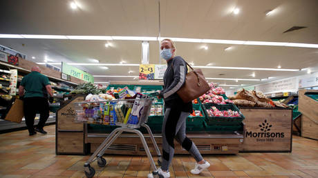 FILE PHOTO: A customer wearing a protective face mask shops at a Morrisons store in St Albans, UK, on September 10, 2020.