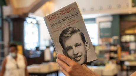 A customer looks through Mary L. Trump's new book about the U.S. President Donald J. Trump is on display at Barnes & Noble store on Broadway in Manhattan.